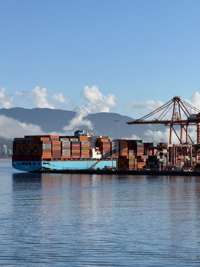 services-02 A cargo ship docked at a shipping container terminal in Vancouver, Canada.